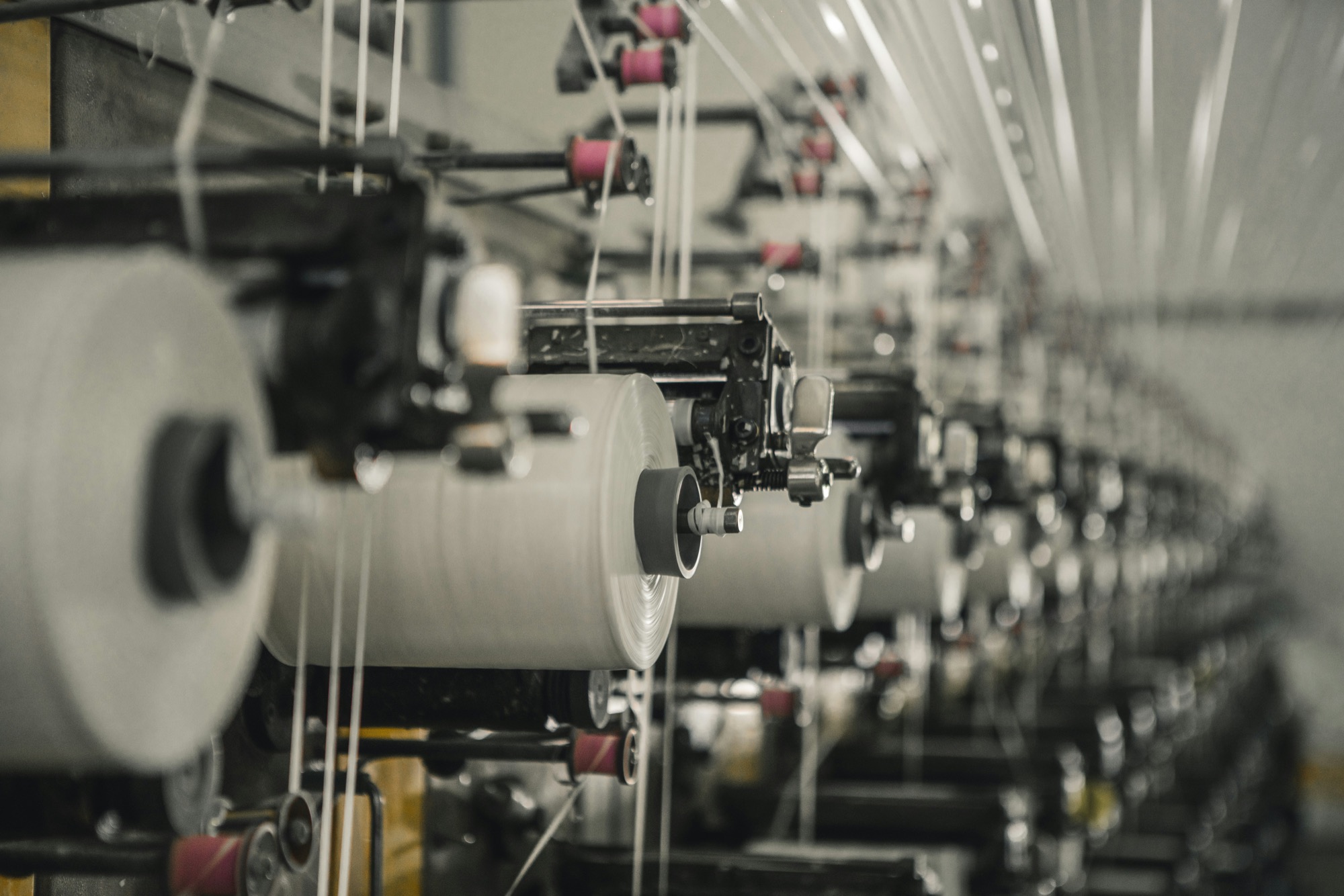 A row of machines receding into shallow focus.